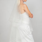 Side view of the 2 tier waltz-length fold over veil with a double row of horsehair trim and scattered Austrian crystals, available in bright white and sparkly light ivory 