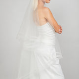 Side view of the 2 tier waltz-length fold over veil with a double row of horsehair trim and scattered Austrian crystals, available in bright white and sparkly light ivory 