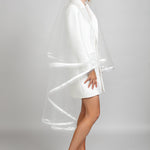 Side view of the Sadie veil highlighting its double-tiered shape, satin ribbon and horsehair trim, and elegant waltz-length silhouette.