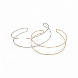 Spencer cuff bracelets in gold and silver side by side