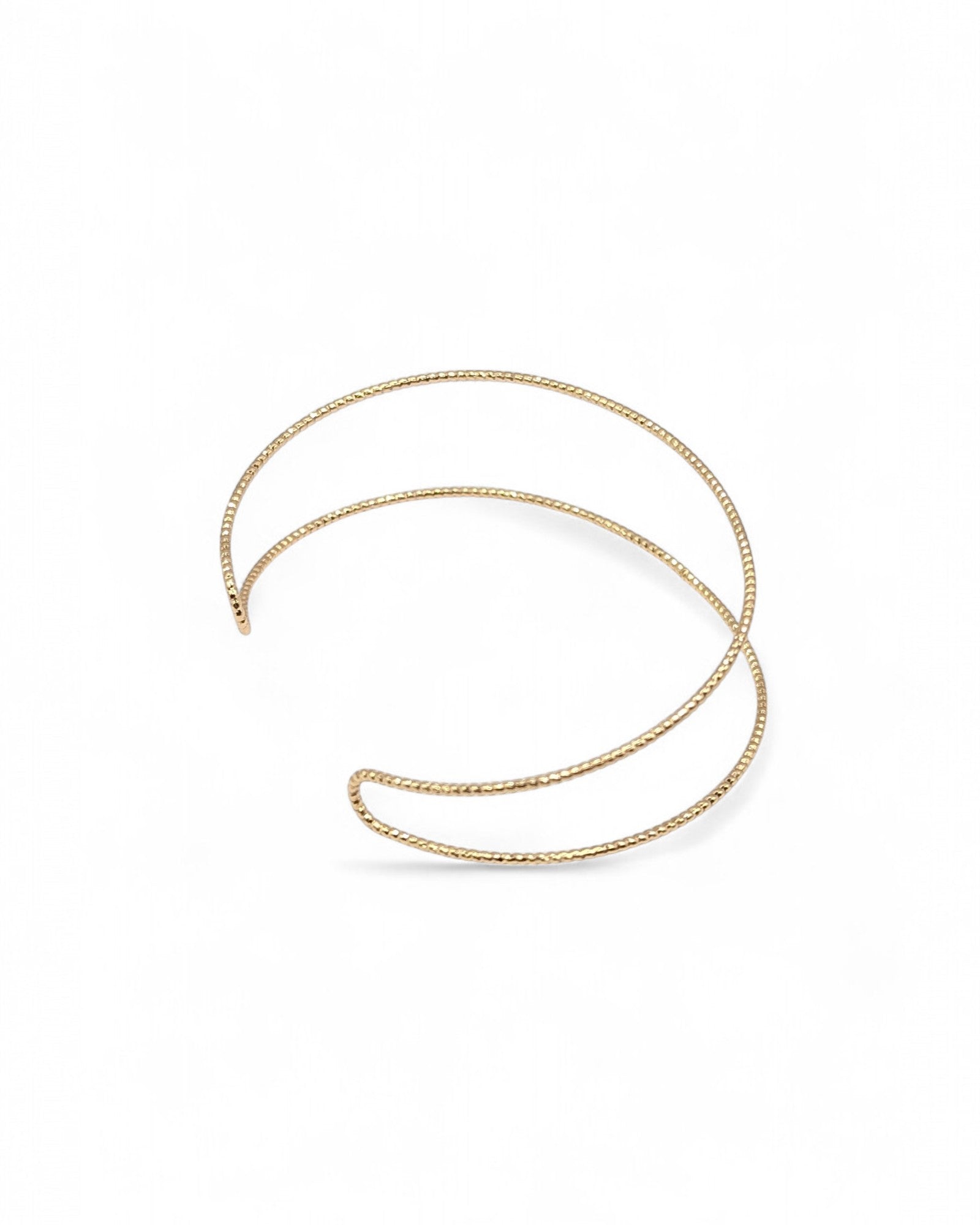 Angled view of Spencer gold cuff bracelet showing double band design