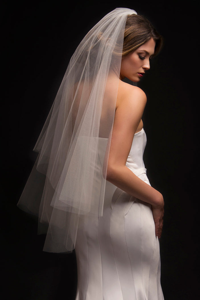 2 tier fingerip length veil with a raw clean cut edge. 