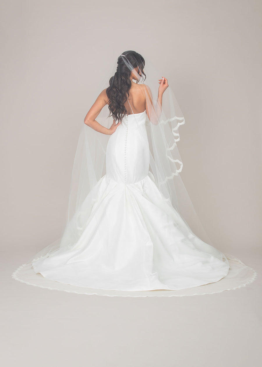 two tier foldover cathedral length veil with reimbroidered lace trim. View from the back