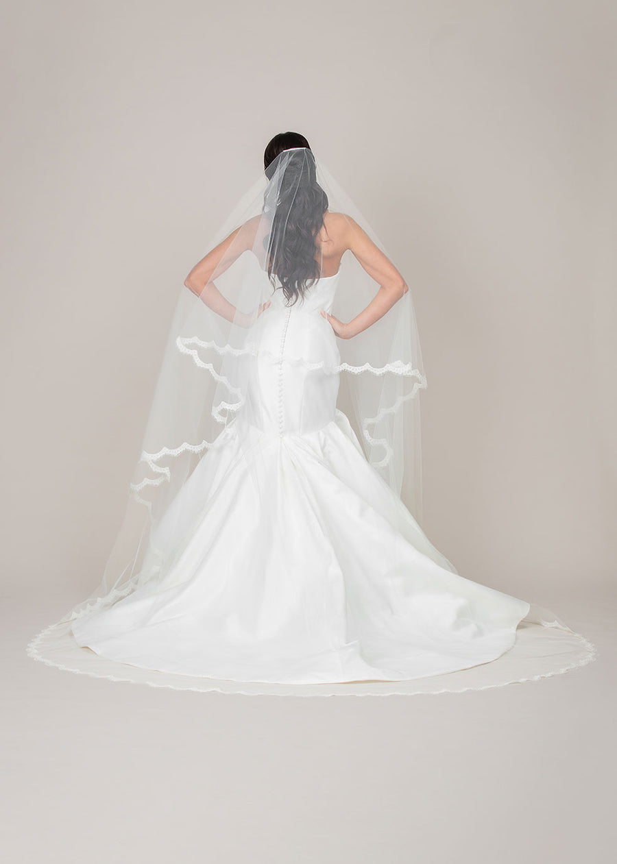 two tier foldover cathedral length veil with reimbroidered lace trim and blusher pull back