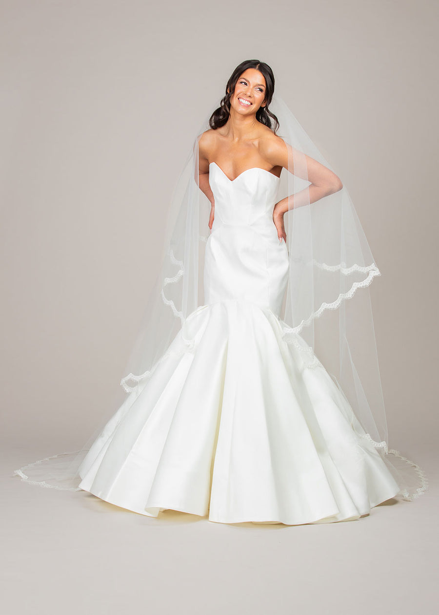 two tier foldover cathedral length veil with reimbroidered lace trim with blusher pulled back