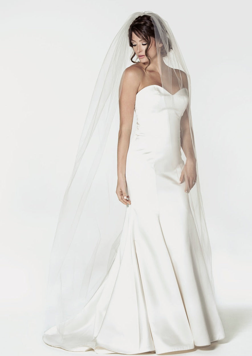 Chapel length bridal veil with a raw cut edge. It is 72" wide.