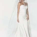 Chapel length bridal veil with a raw cut edge. It is 72" wide.