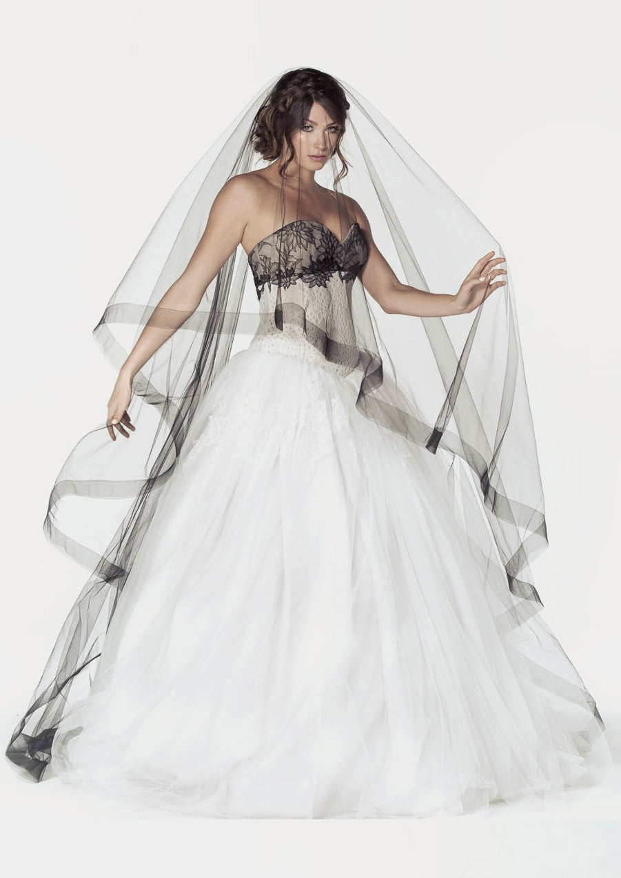 Two tier cathedral length bridal veil with a 2 inch wide horsehair trim. Shown in black.