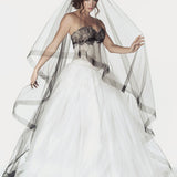 Two tier cathedral length bridal veil with a 2 inch wide horsehair trim. Shown in black.
