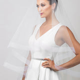 Two tier cathedral length horsehair trim bridal veil shown in off white